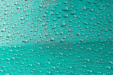 water drop on blue background.dew drop on blue texture of floor.macro dew drop.