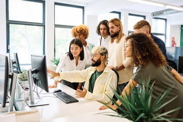 Meeting in front of the computer in a coworking