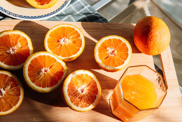 Large greek oranges, halved and ready to be squeezed for some golden, delicious juice.