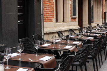 Table setting in a restaurant for serving dinner, empty wine glasses on the table in the restaurant