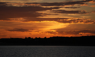 gorgeous sunset over a lake. red sky at sunset.