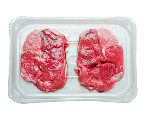 Two boneless lamb leg steaks on a plastic tray. Uncooked high quality meat product with rich taste and vivid color.