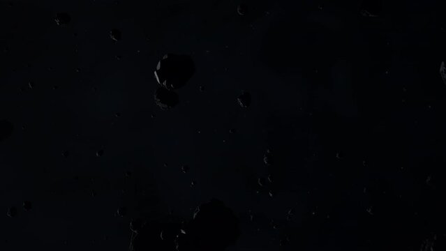 Asteroid belt field in dark outer space. 3D animation wide pan shot. Rock formations of cosmic debris and giant Meteorites. Celestial objects on starry stars background with dust nebula haze low light