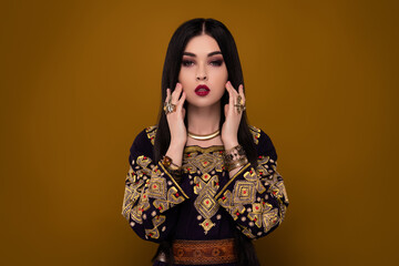 Photo of gorgeous arab lady sultan wife wealthy touch with prceious rings jewel over pastel...