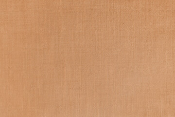 Texture background of orange linen fabric. Textile structure, cloth surface, weaving of natural cotton fabric closeup, backdrop, wallpaper.