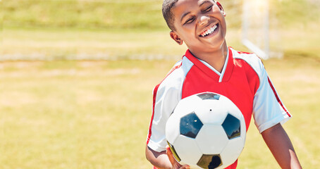 Happy, soccer and child on sport field with soccer ball excited for training, game or competition...