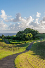 The beautiful landscape of a golf course in Princeville with a view of the sea on the island of...