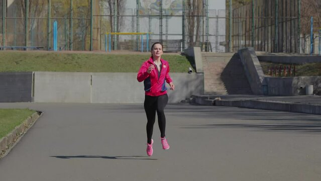 Young girl doing a race at the stadium