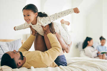 Happy family, airplane and father with girl child on a bed for playing, bond and relax in their...