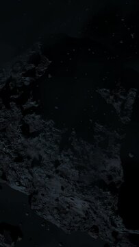 Asteroid belt field in dark outer space. 3D animation wide pan shot. Rock formations of cosmic debris and giant Meteorites. Celestial objects on starry stars background with dust nebula haze low light