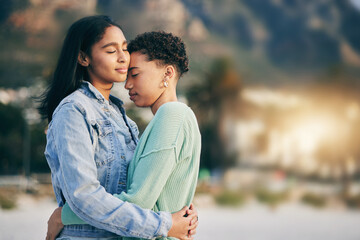 Women hug, lesbian and couple with peace and love, pride with gen z youth and romance outdoor. Female people together, gay relationship and lgbt with date, partner and trust with embrace and support