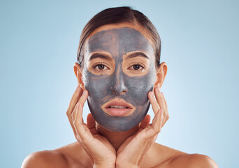 Face mask, skincare and woman with beauty, dermatology and girl on a blue studio background....