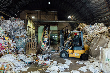 Sorting, loading and packing of wastepaper in recycling factory