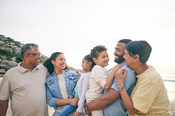 Family, grandparents and parents with kids at the beach, happiness and bonding on a happy holiday. Love, care and smile, men and women with children outdoor, summer vacation and relax by the sea