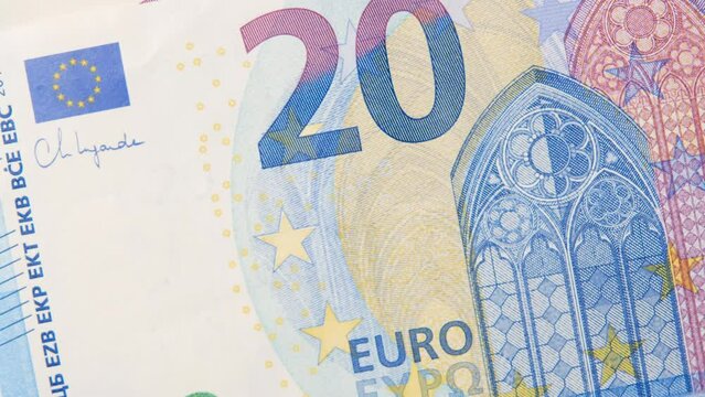 Twenty euro background. Close up on Many euro money bills. EU money banknotes. Money or European union currency concept. Man hand counting euros