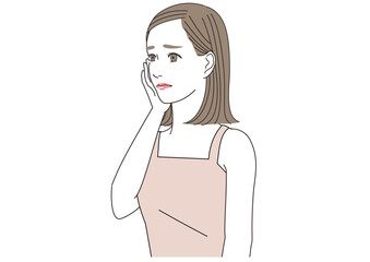 頬に手をあてて悩んでいる表情の若い女性