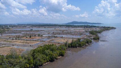 Aerial view of the fish farming area with very large land located on the edge of the sea