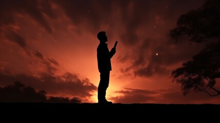 Silhouette of person stand and feel happy on use phone the most hight of technology communication. background sunrise, advertisement, alone, dark