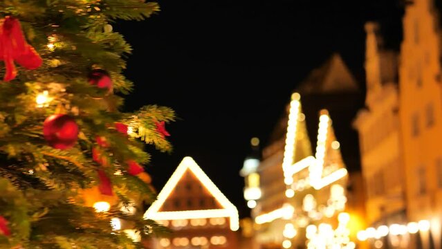 Christmas Rothenburg ob der Tauber . Soft focus.Christmas tree with balls and shining garlands.town blur background. Streets of the evening Christmas city. 4k footage