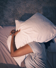 Sleep, insomnia and woman with pillow on head, tired and frustrated with stress, nightmare or dream...