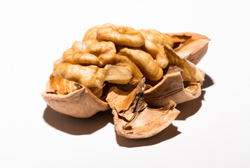 Walnuts are rounded, single-seeded stone fruits of the walnut tree. Cracking a nut.