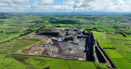 Aerial photo of a working Black Stone Quarry lorries and diggers