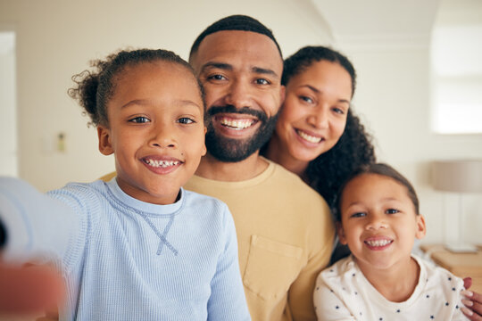 Face of parents, children and happy for selfie in home for love, care and quality time together. Portrait of mother, father and young kids smile to capture profile picture for memory in family house