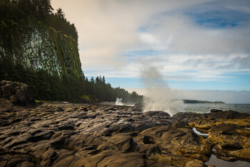 Water rushing up from the blow hole in Naikoon Provincial Park, Haida Gwaii, British Columbia,...