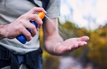 Sunscreen spray, hand and closeup while hiking for security from the sun and health in summer....