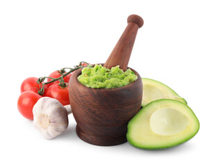 Mortar with delicious guacamole and ingredients isolated on white