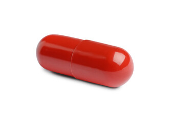 One red pill on white background. Medicinal treatment
