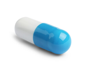 One pill on white background. Medicinal treatment