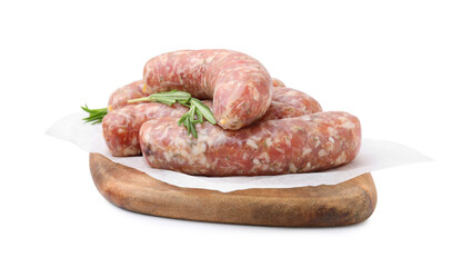 Wooden board with raw homemade sausages and rosemary isolated on white