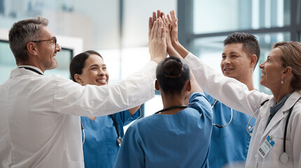 Hands, high five and collaboration with a team of a doctor, nurse and health professional working in the hospital. Teamwork, motivation and support with a medical group at work in a clinic for care - obrazy, fototapety, plakaty