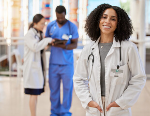 Woman, portrait and doctor smile for medical services, advice and consulting in busy hospital....