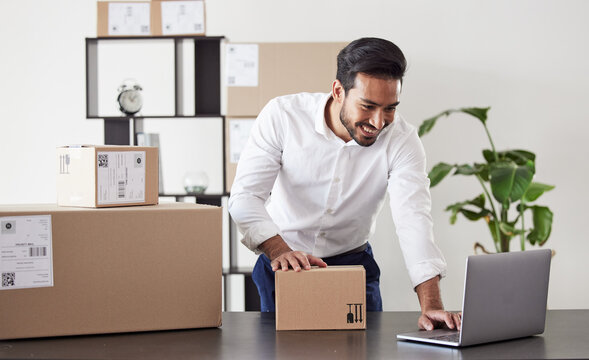 Laptop, box and business Asian man for logistics startup for shipping, delivery and distribution service. Ecommerce, supply chain and male person on computer planning for package, parcel and order
