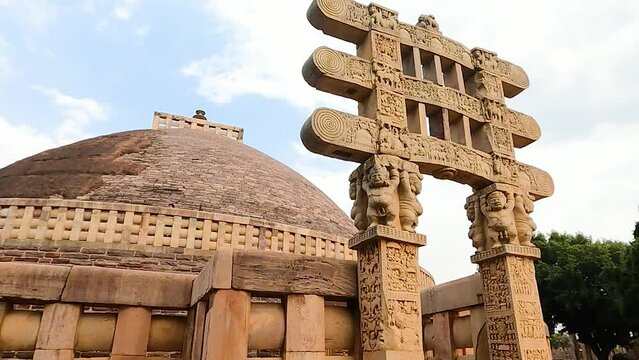 Sanchi stupa is an ancient Buddhist monument and popular tourist destination in India. It has several gates with inscriptions. It is located in madhya pradesh india.