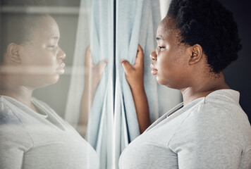 Window, thinking or black woman with depression, stress or mental health crisis by curtain at home....