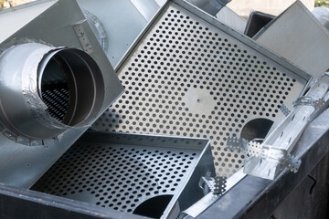process of disassembling a ceiling ventilation system, aluminum construction waste is meticulously...