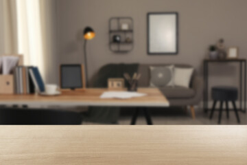 Empty wooden table in comfortable office. Space for design