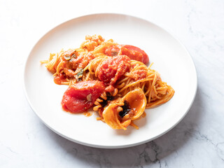Tomato and cuttlefish pasta on a plate	