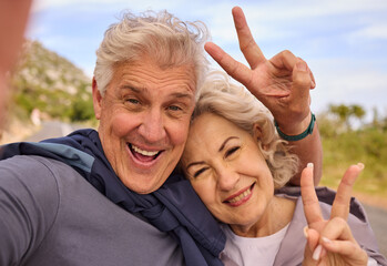 Senior couple, fitness and selfie with peace sign for smile, outdoor and nature for portrait together. Elderly man, woman and hand for emoji, health and love for profile picture, training and workout