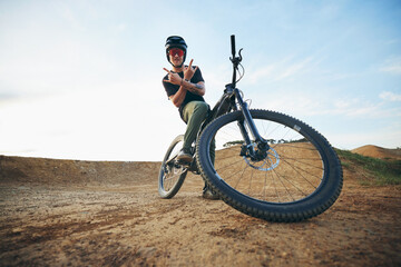 Mountain bike, portrait and with man shaka hand sign on path for extreme sports, happiness and...
