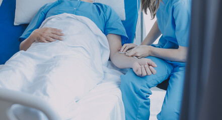 Injured patient showing doctor broken wrist and arm with bandage in hospital office or emergency...