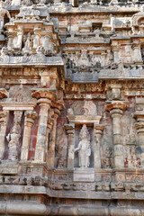 Statue of Hindu God in stone relief Temple wall at Airavatesvara Temple, Darasuram, Kumbakonam, Tamilnadu.