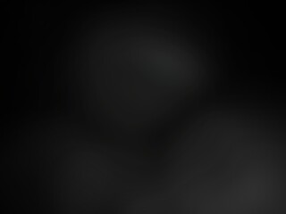 Abstract blurred background image of black color gradient used as an illustration. Designing posters or advertisements.