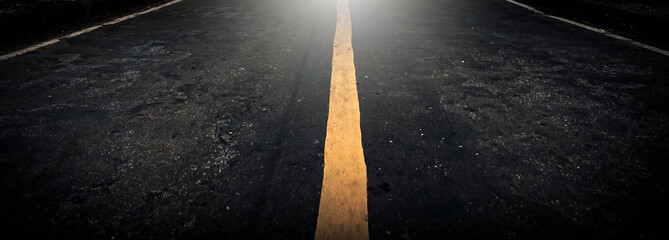 Asphalt road with yellow line. Abstract background and texture for design.