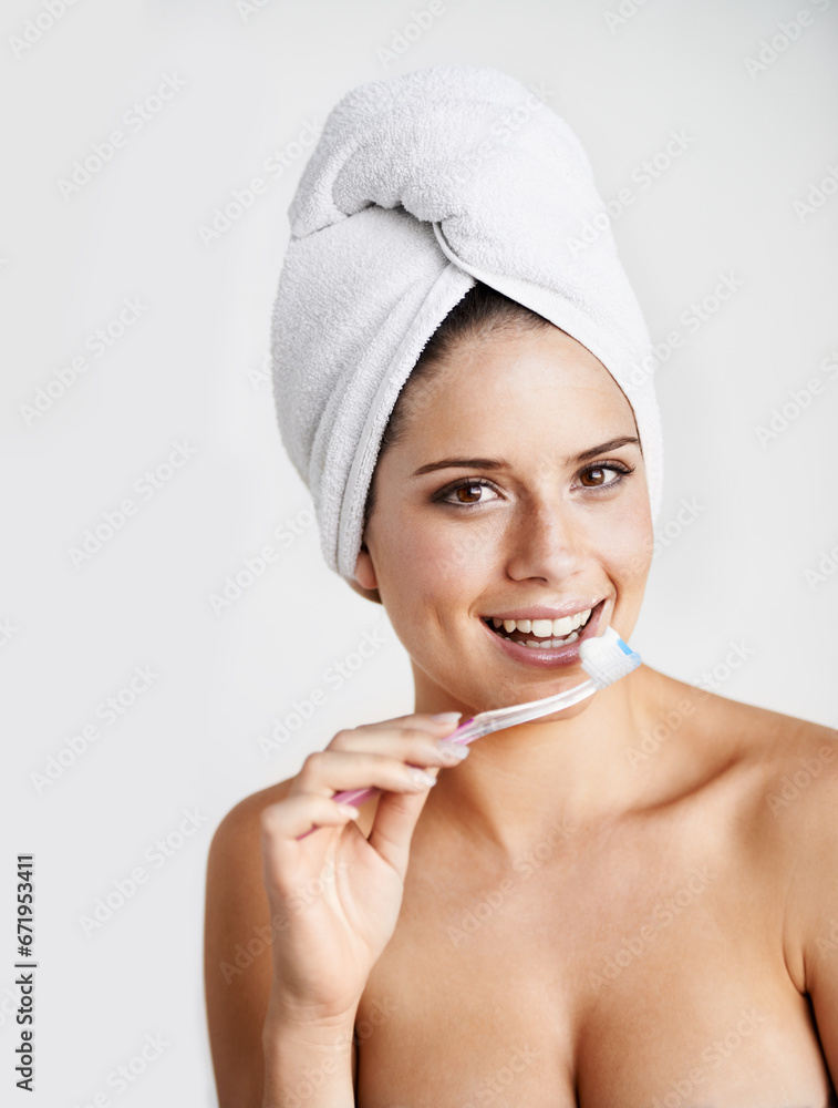 Wall mural Woman, portrait and toothbrush for dental hygiene, teeth whitening and healthcare for gums in studio. Happy female person, smile and cleaning mouth for protection, brushing and white background