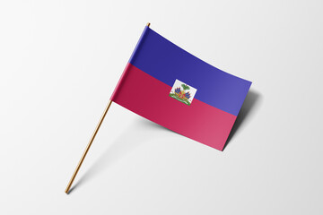 Haiti flag of small paper, isolated on white background