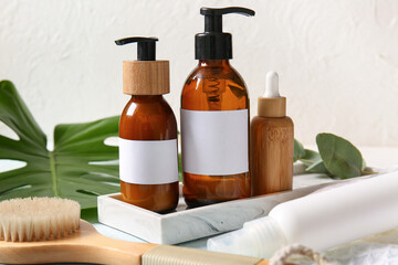 Obraz na płótnie Canvas Different bottles of shampoo on white background